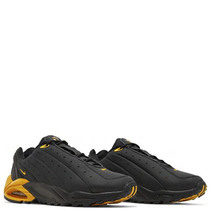 NOCTA x Nike Hot Step Air Terra Black and University Gold